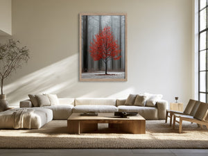 Light wood-framed red-leaved tree artwork above a sectional sofa and wooden coffee table.