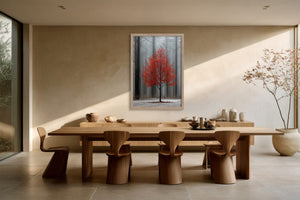 Light wood-framed red-leaved tree artwork centered above a long wooden dining table and chairs.