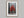 Scarlet Stillness shown in an oak frame with a white border or mount.