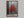 Scarlet Stillness shown in a walnut frame without a border or mount.