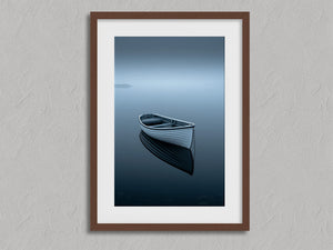 Drift Afloat shown in a walnut frame with a white border or mount.