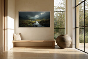 Framed mountain valley stream artwork above a built-in bench beside large black-framed windows.