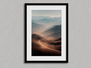 Winding Light - Desert Mountain Valley shown in a black frame with a white border or mount.